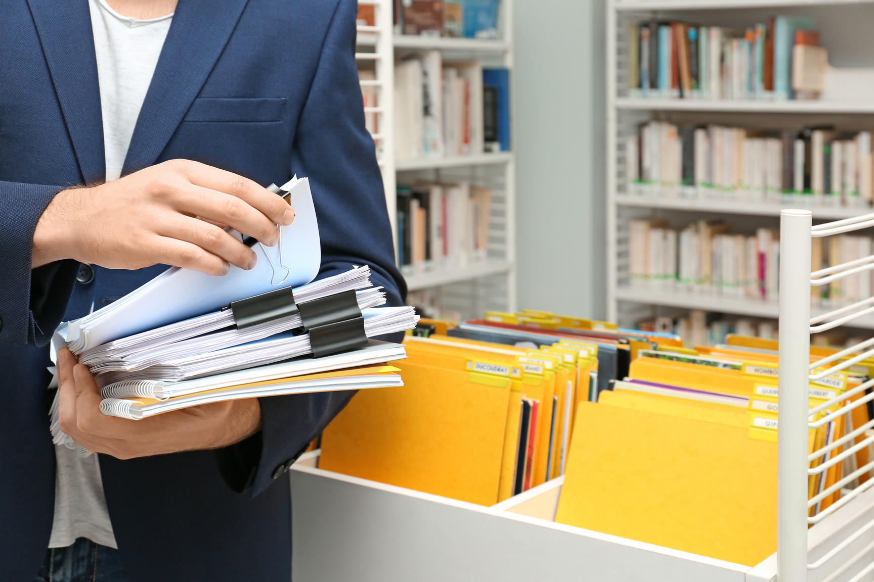 Man Searching for Documents in Archive